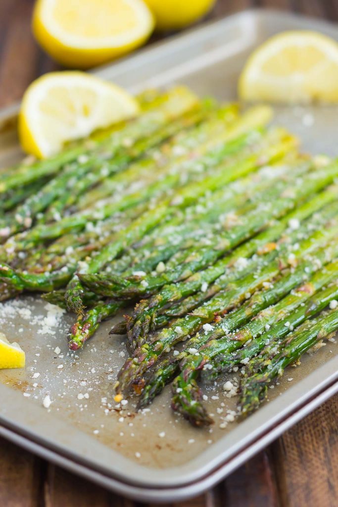 side shot of oven baked asparagus with lemon and parmesan