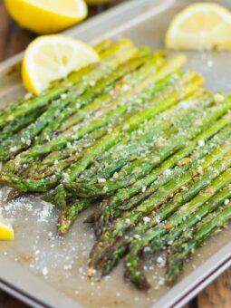 angled shot of roasted asparagus in a pan
