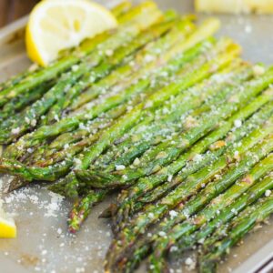 angled shot of roasted asparagus in a pan