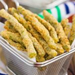 These Baked Parmesan Green Bean Fries are coated with a mixture of Parmesan cheese and spices, and then baked until golden. Crispy, crunchy, and full of flavor, these healthier fries make the perfect appetizer or easy side dish!