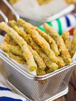 These Baked Parmesan Green Bean Fries are coated with a mixture of Parmesan cheese and spices, and then baked until golden. Crispy, crunchy, and full of flavor, these healthier fries make the perfect appetizer or easy side dish!