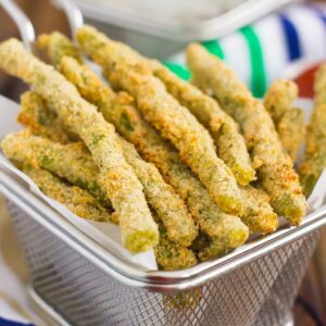 These Baked Parmesan Green Bean Fries are coated with a mixture of Parmesan cheese and spices, and then baked until golden. Crispy, crunchy, and full of flavor, these healthier fries make the perfect appetizer or easy side dish!