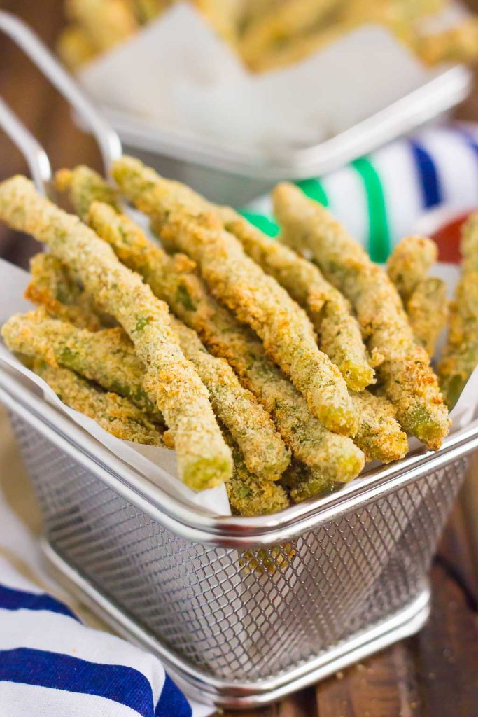 parmesan green bean fries in a fryer basket 