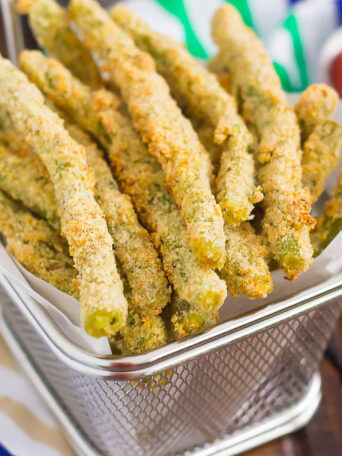 These Baked Parmesan Green Bean Fries are coated with a mixture of Parmesan cheese and spices, and then baked until golden. Crispy, crunchy, and full of flavor, these healthier fries make the perfect appetizer or easy side dish!