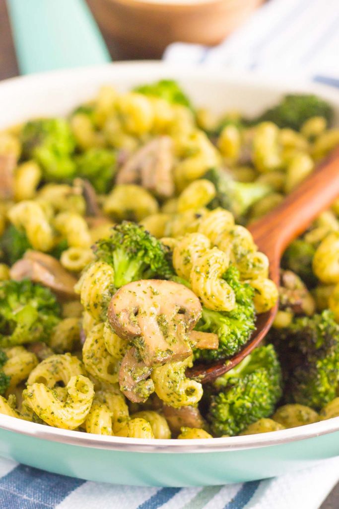 basil pesto pasta in skillet with serving spoon