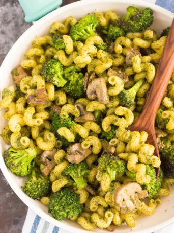 This Basil Pesto Pasta with Broccoli and Mushrooms is an easy dish that's full of flavor. Tender pasta is tossed with basil pesto, sautéed mushroom, and fresh broccoli. It's simple to make and is perfect for busy weeknights!