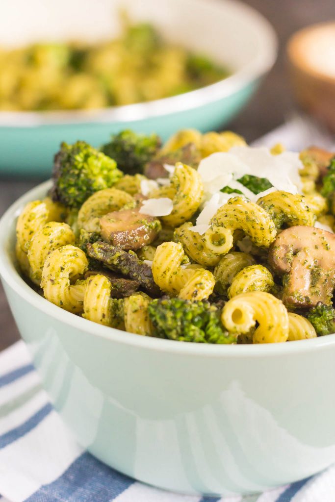 bowl of basil pesto pasta with mushrooms and broccoli 