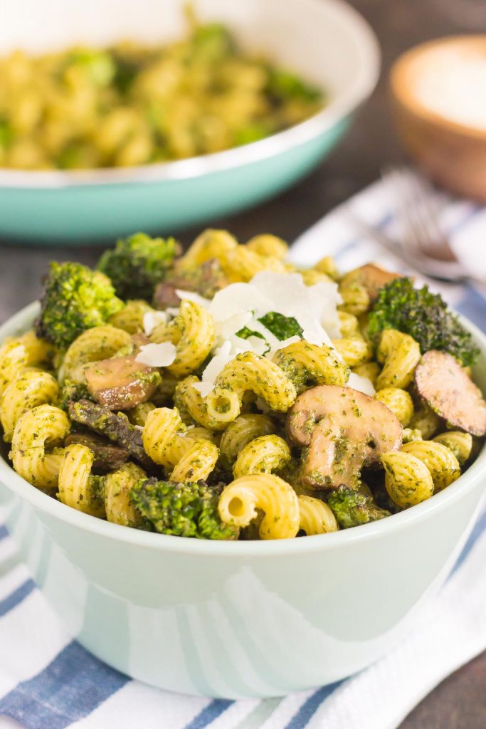 broccoli and mushroom pesto pasta in white bowl