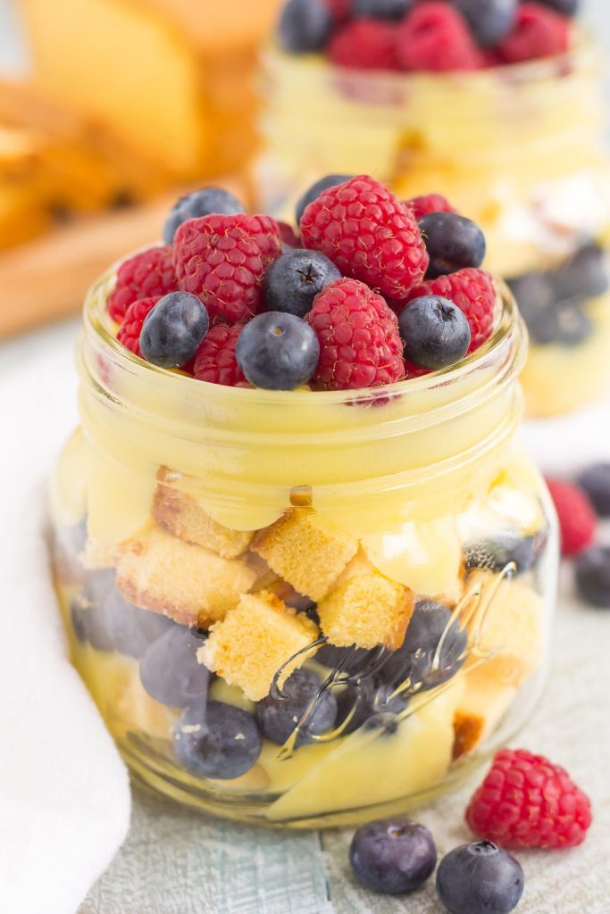 A berry and pound cake trifle in a glass jar. 