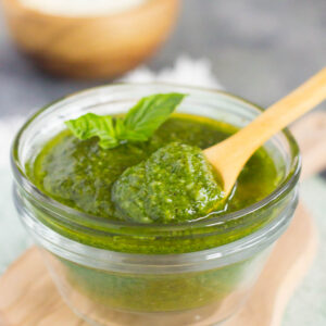 This Easy Basil Pesto combines fresh basil leaves, Parmesan cheese, garlic cloves, pine nuts, and olive oil. It's a simple sauce that comes together in minutes and is perfect for serving with pasta, bread, chicken, and a variety of other dishes!