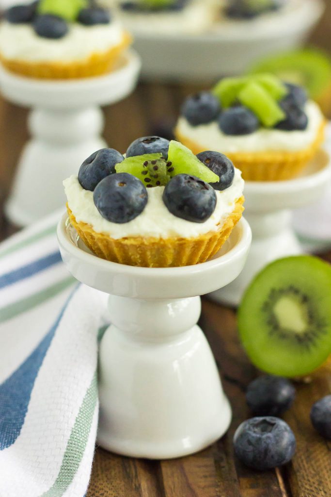These Mini Blueberry Kiwi Tarts start with a simple, vanilla crust that's packed with a creamy mascarpone filling and topping with fresh blueberries and kiwi. This easy, make-ahead dessert is perfect to serve for your next party or get-together!