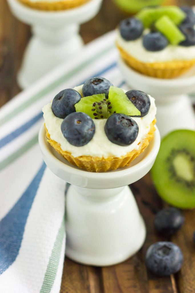 These Mini Blueberry Kiwi Tarts start with a simple, vanilla crust that's packed with a creamy mascarpone filling and topping with fresh blueberries and kiwi. This easy, make-ahead dessert is perfect to serve for your next party or get-together!
