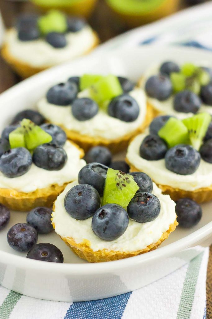 These Mini Blueberry Kiwi Tarts start with a simple, vanilla crust that's packed with a creamy mascarpone filling and topping with fresh blueberries and kiwi. This easy, make-ahead dessert is perfect to serve for your next party or get-together!
