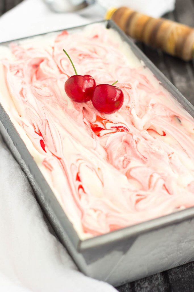 This easy, five ingredient Cherry Cheesecake Ice Cream is cool, creamy and packed with flavor. This no-churn treat features a vanilla cheesecake base that's loaded with juicy cherries. And best of all, it's made without an ice cream maker!