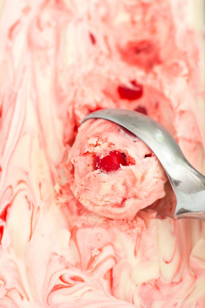 This easy, five ingredient Cherry Cheesecake Ice Cream is cool, creamy and packed with flavor. This no-churn treat features a vanilla cheesecake base that's loaded with juicy cherries. And best of all, it's made without an ice cream maker!