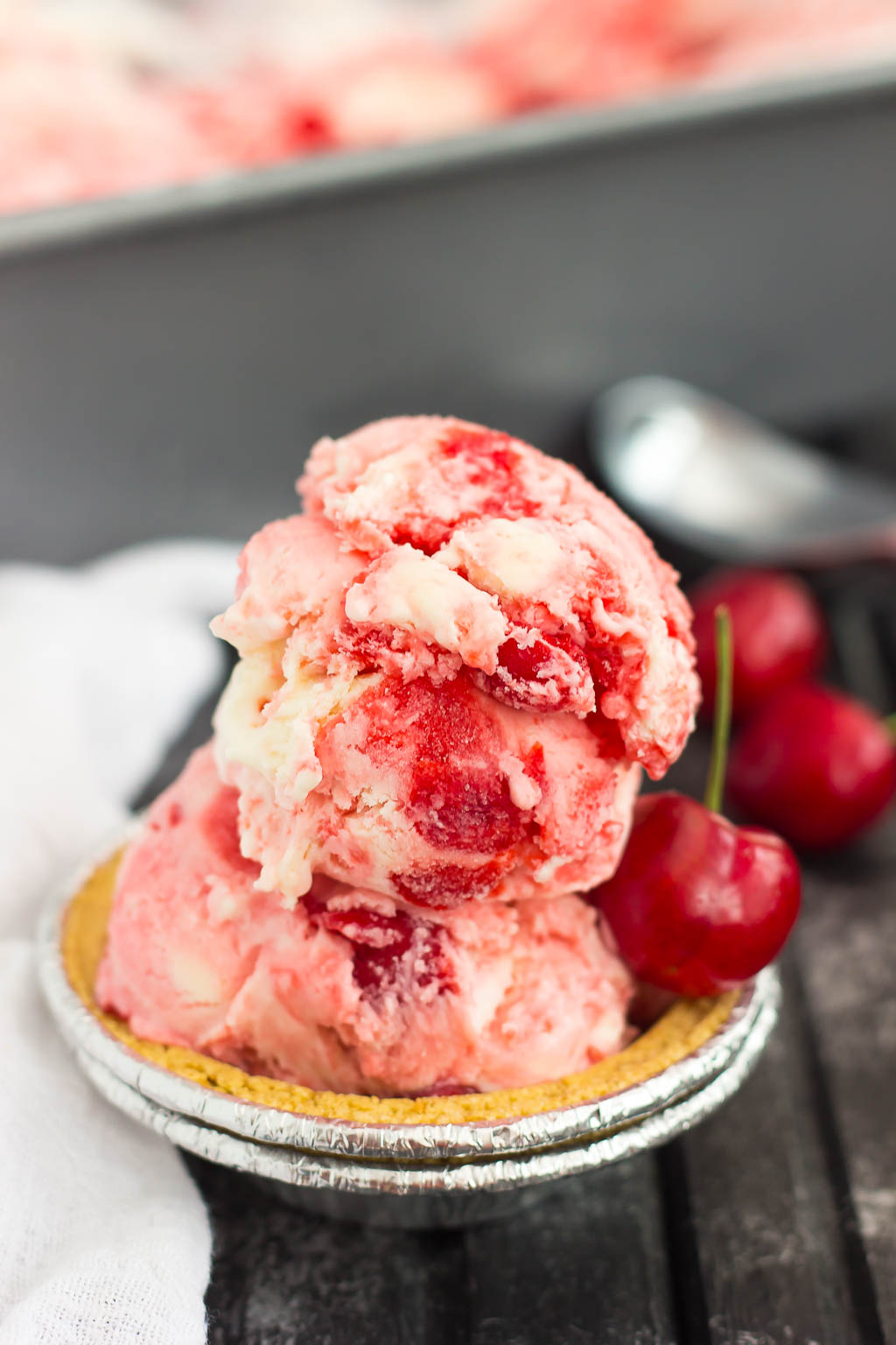 This easy, five ingredient Cherry Cheesecake Ice Cream is cool, creamy and packed with flavor. This no-churn treat features a vanilla cheesecake base that's loaded with juicy cherries. And best of all, it's made without an ice cream maker!