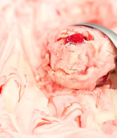 This easy, five ingredient Cherry Cheesecake Ice Cream is cool, creamy and packed with flavor. This no-churn treat features a vanilla cheesecake base that's loaded with juicy cherries. And best of all, it's made without an ice cream maker!