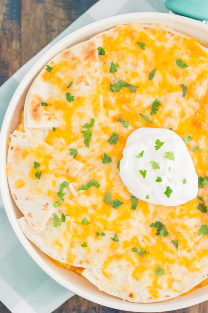 This One Pan Chicken Enchilada Bake is loaded with shredded chicken, hearty rice, and topped with cheesy tortillas. It contains the classic flavor of enchiladas, but in casserole form. Made in one pan and ready in just 30 minutes, you'll have this simple dish ready to be devoured in no time!