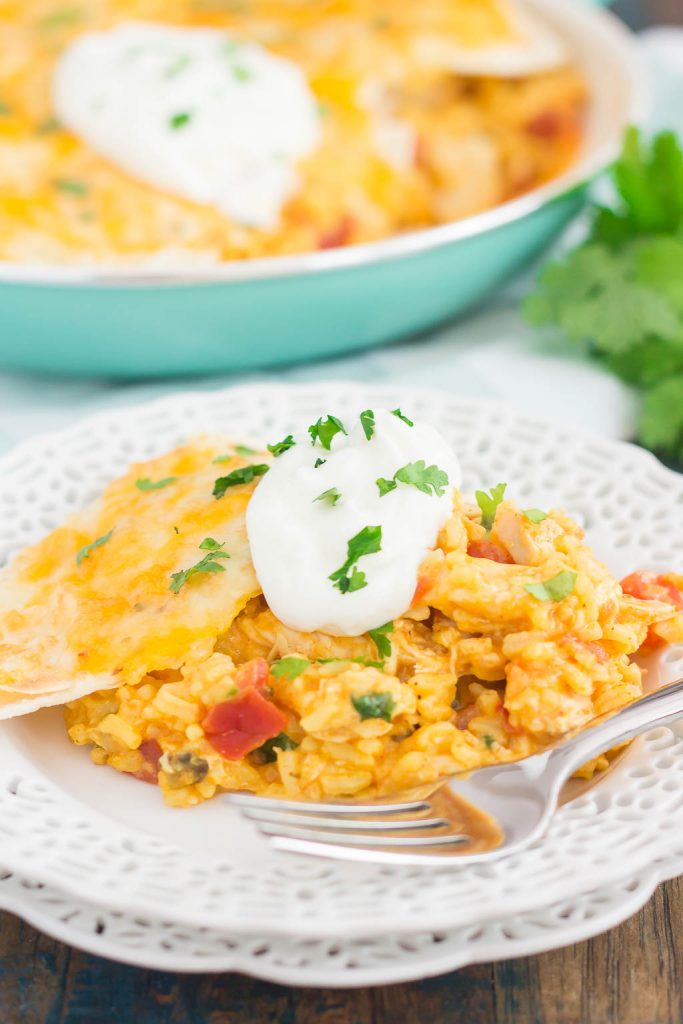 This One Pan Chicken Enchilada Bake is loaded with shredded chicken, hearty rice, and topped with cheesy tortillas. It contains the classic flavor of enchiladas, but in casserole form. Made in one pan and ready in just 30 minutes, you'll have this simple dish ready to be devoured in no time!