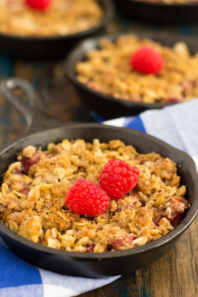 This Raspberry Rhubarb Crisp is filled with sweet raspberries, fresh rhubarb, and sprinkled with a brown sugar oat crumble. It's prepared in just minutes and makes an easy dessert that's perfect to enjoy all year long!