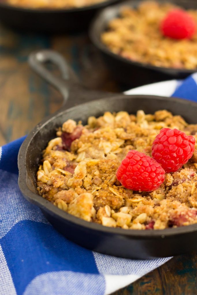 A simple rhubarb crisp with raspberries, in a mini cast iron skillet. 