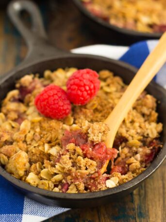 This Raspberry Rhubarb Crisp is filled with sweet raspberries, fresh rhubarb, and sprinkled with a brown sugar oat crumble. It's prepared in just minutes and makes an easy dessert that's perfect to enjoy all year long!