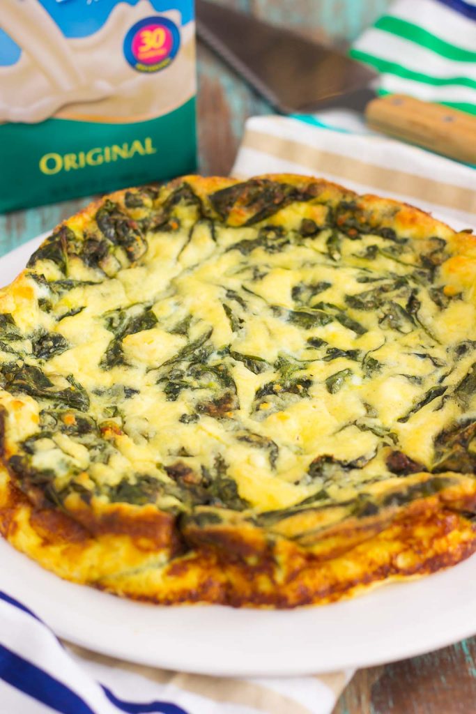 This Spinach and Feta Frittata is full of fresh spinach and creamy feta cheese. It's healthy, gluten free, and perfect for just about any meal. If you're looking for that delicious meatless dish for breakfast, brunch, or dinner, then this is it!