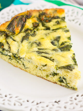 This Spinach and Feta Frittata is full of fresh spinach and creamy feta cheese. It's healthy, gluten free, and perfect for just about any meal. If you're looking for that delicious meatless dish for breakfast, brunch, or dinner, then this is it!