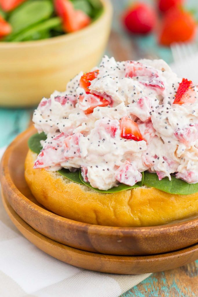 This Strawberry Poppy Seed Chicken Salad is packed with shredded chicken, a light dressing of Greek yogurt and mayo, and bursting with juicy strawberries and poppy seeds. This dish is fresh, flavorful, and filled with just the right amount of sweetness! #strawberrychicken #strawberrychickensalad #strawberrypoppyseed #poppyseedchickensalad #chickensalad #chicken #healthylunch #healthysalad #summersalad
