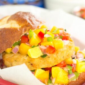 These Alaskan Pollock Burgers with Peach Mango Salsa are easy to prepare and bursting with flavor. The Alaskan Pollock patty provides a mild taste, while the peach mango salsa gives it the perfect touch of sweet and spicy. If you're looking for a new burger filed with the tastes of summer, then this is it!