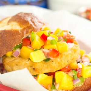 These Alaskan Pollock Burgers with Peach Mango Salsa are easy to prepare and bursting with flavor. The Alaskan Pollock patty provides a mild taste, while the peach mango salsa gives it the perfect touch of sweet and spicy. If you're looking for a new burger filed with the tastes of summer, then this is it!