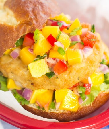 These Alaskan Pollock Burgers with Peach Mango Salsa are easy to prepare and bursting with flavor. The Alaskan Pollock patty provides a mild taste, while the peach mango salsa gives it the perfect touch of sweet and spicy. If you're looking for a new burger filed with the tastes of summer, then this is it!