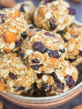 These Blueberry Almond Butter Energy Bites are packed with healthier ingredients to make an easy, on-the-go breakfast or snack. Filled with hearty oats, dried blueberries, chia seeds, honey, and almond butter, these bites take just minutes to make and are full of flavor!