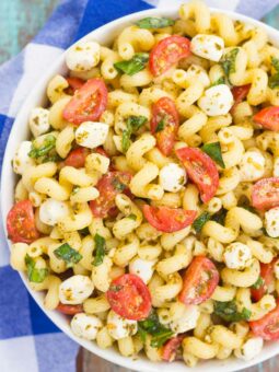 This Caprese Pasta Salad is filled with tender noodles, cherry tomatoes, fresh basil, and creamy mozzarella cheese. It's tossed in a white balsamic and pesto dressing, which gives this dish a burst of flavor. Simple, fresh, and full of flavor, this pasta salad is ready in minutes and is perfect for summer!