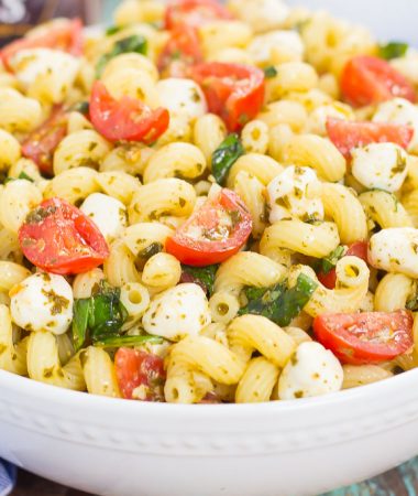 This Caprese Pasta Salad is filled with tender noodles, cherry tomatoes, fresh basil, and creamy mozzarella cheese. It's tossed in a white balsamic and pesto dressing, which gives this dish a burst of flavor. Simple, fresh, and full of flavor, this pasta salad is ready in minutes and is perfect for summer!