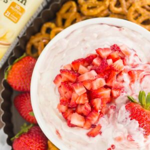 This no-bake, Greek Yogurt Strawberry Cheesecake Dip tastes just like your favorite cheesecake, in healthier form. With just five ingredients and hardly any prep time, you can have this easy dessert ready in less than 10 minutes. It's perfect to serve with some fresh fruit or pretzels, and makes a tasty dish for your summer parties or just for when you want something sweet!