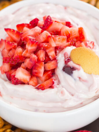 This no-bake, Greek Yogurt Strawberry Cheesecake Dip tastes just like your favorite cheesecake, in healthier form. With just five ingredients and hardly any prep time, you can have this easy dessert ready in less than 10 minutes. It's perfect to serve with some fresh fruit or pretzels, and makes a tasty dish for your summer parties or just for when you want something sweet!