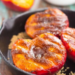 These Grilled Peaches with Cinnamon and Brown Sugar are a delicious, healthier dessert. Fresh peaches are lightly grilled and then topped with a cinnamon and brown sugar mixture that caramelizes to perfection. With just four ingredients and hardly any prep time, you can have this easy dish ready in minutes!
