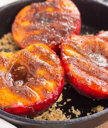 These Grilled Peaches with Cinnamon and Brown Sugar are a delicious, healthier dessert. Fresh peaches are lightly grilled and then topped with a cinnamon and brown sugar mixture that caramelizes to perfection. With just four ingredients and hardly any prep time, you can have this easy dish ready in minutes!