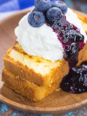 This Grilled Pound Cake with Mascarpone Cream and Blueberries is an easy dessert that's perfect for summer. Slices of pound cake are lightly grilled and topped with mascarpone whipped cream and blueberries. Fast, fresh, and simple to prepare, this dish is ready in less than 20 minutes and is sure to be a crowd-pleaser!