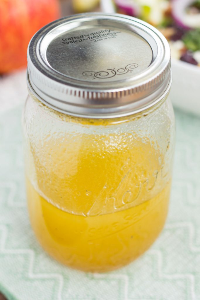 a simple apple cider vinaigrette in a sealed mason jar