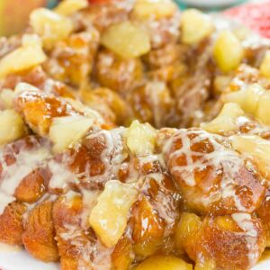 This Apple Pie Monkey Bread is a deliciously sweet and easy dish that makes the perfect breakfast or dessert! With just a few and minimal prep time, this pull-apart bread is soft, gooey, and bursting with apple chunks and warm spices. One bit and this will become your favorite fall treat!