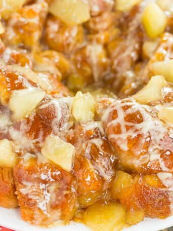 This Apple Pie Monkey Bread is a deliciously sweet and easy dish that makes the perfect breakfast or dessert! With just a few and minimal prep time, this pull-apart bread is soft, gooey, and bursting with apple chunks and warm spices. One bit and this will become your favorite fall treat!