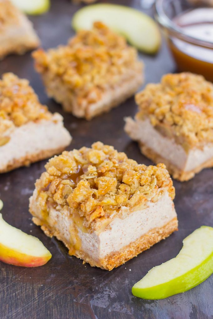 These Caramel Apple Cheesecake Bars are filled with an apple pie cheesecake batter and then sprinkled with tender apples, a sweet streusel topping, and a drizzle of caramel. Simple to prepare and even better to eat, this dessert captures the delicious flavors of fall! #cheesecake #cheesecakerecipes #cheesecakebars #applecheesecakerecipe #caramelapplerecipe #falldesserts #falldessertrecipe