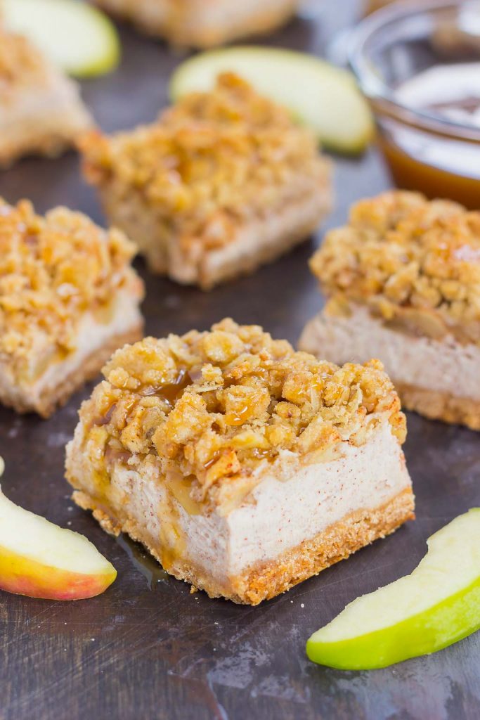 These Caramel Apple Cheesecake Bars are filled with an apple pie cheesecake batter and then sprinkled with tender apples, a sweet streusel topping, and a drizzle of caramel. Simple to prepare and even better to eat, this dessert captures the delicious flavors of fall! #cheesecake #cheesecakerecipes #cheesecakebars #applecheesecakerecipe #caramelapplerecipe #falldesserts #falldessertrecipe