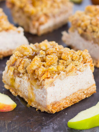 These Caramel Apple Cheesecake Bars are filled with an apple pie cheesecake batter and then sprinkled with tender apples, a sweet streusel topping, and a drizzle of caramel. Simple to prepare and even better to eat, this dessert captures the delicious flavors of fall!