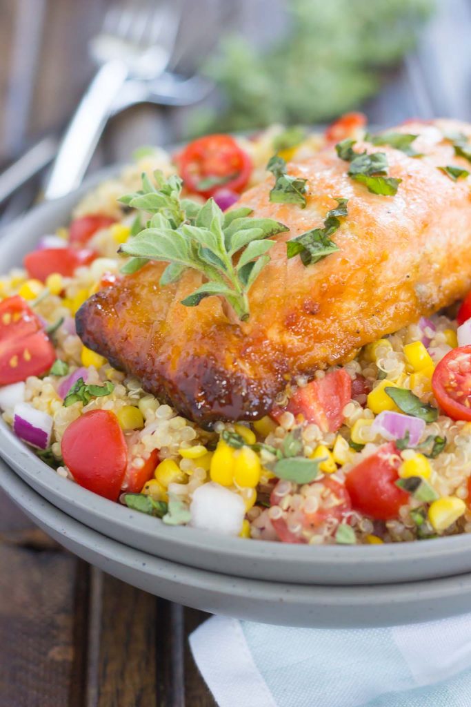 a salmon and quinoa bowl, packed with fresh veggies