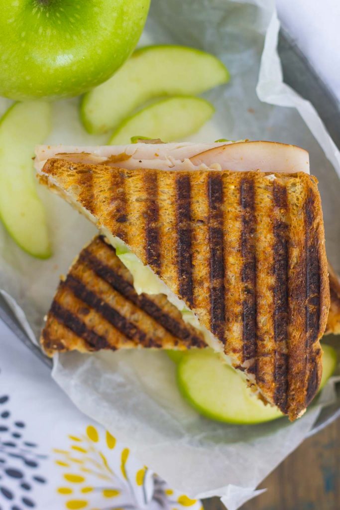 This Turkey, Apple and Brie Panini is the perfect fall-inspired sandwich. It's packed with fresh turkey, granny smith apples, creamy brie cheese and then toasted until golden. Simple, fast, and bursting with flavor, this sweet and savory combo makes a delicious lunch or dinner!