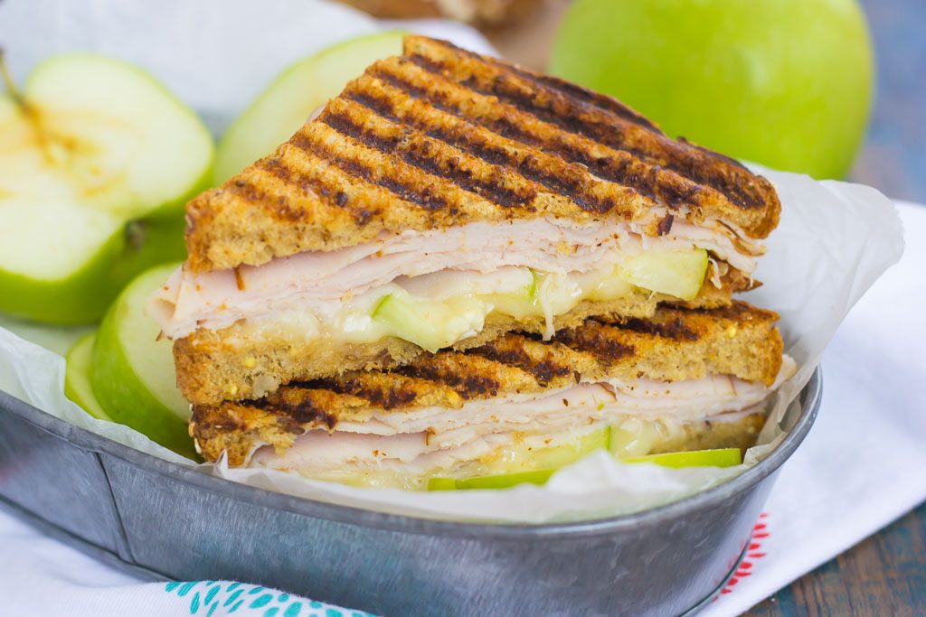 This Turkey, Apple and Brie Panini is the perfect fall-inspired sandwich. It's packed with fresh turkey, granny smith apples, creamy brie cheese and then toasted until golden. Simple, fast, and bursting with flavor, this sweet and savory combo makes a delicious lunch or dinner!