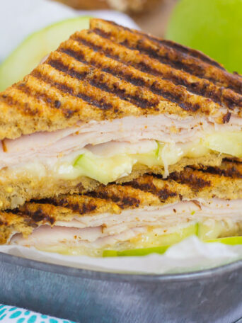 This Turkey, Apple and Brie Panini is the perfect fall-inspired sandwich. It's packed with fresh turkey, granny smith apples, creamy brie cheese and then toasted until golden. Simple, fast, and bursting with flavor, this sweet and savory combo makes a delicious lunch or dinner!